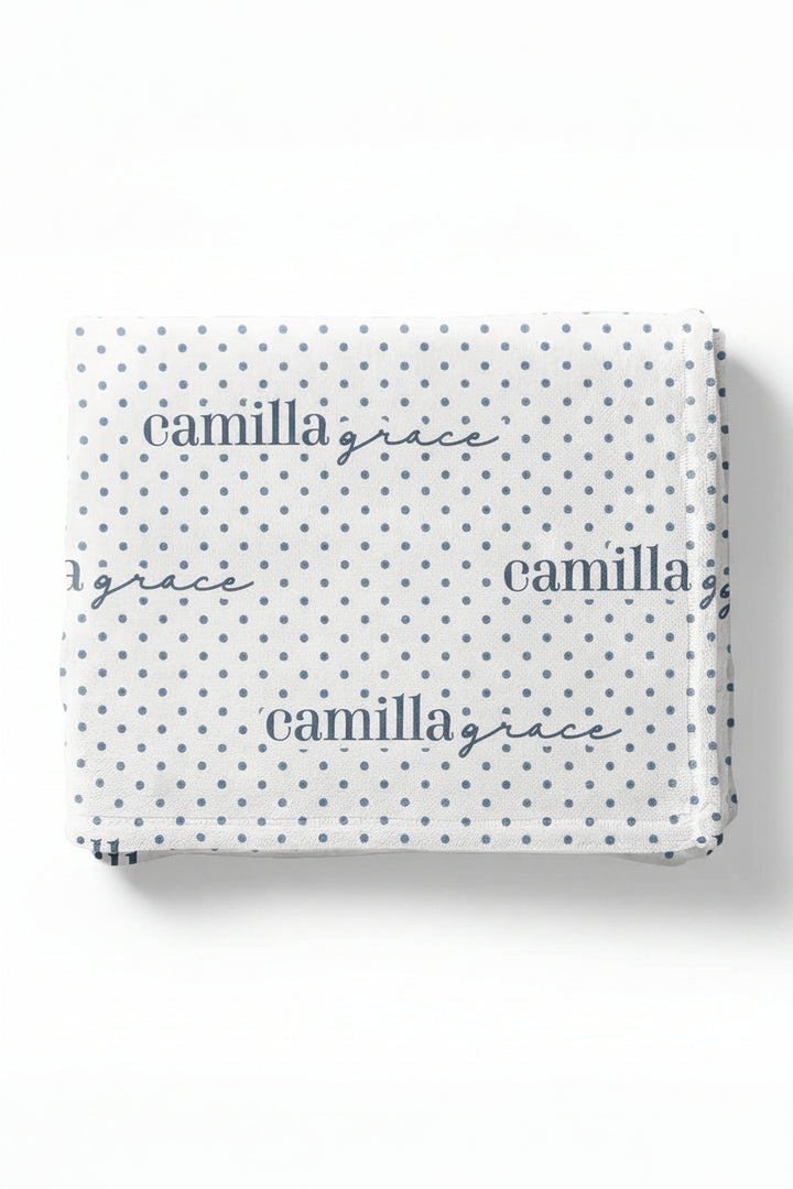 white winky blanket for kids with blue polka dots that is personalized with kids name 