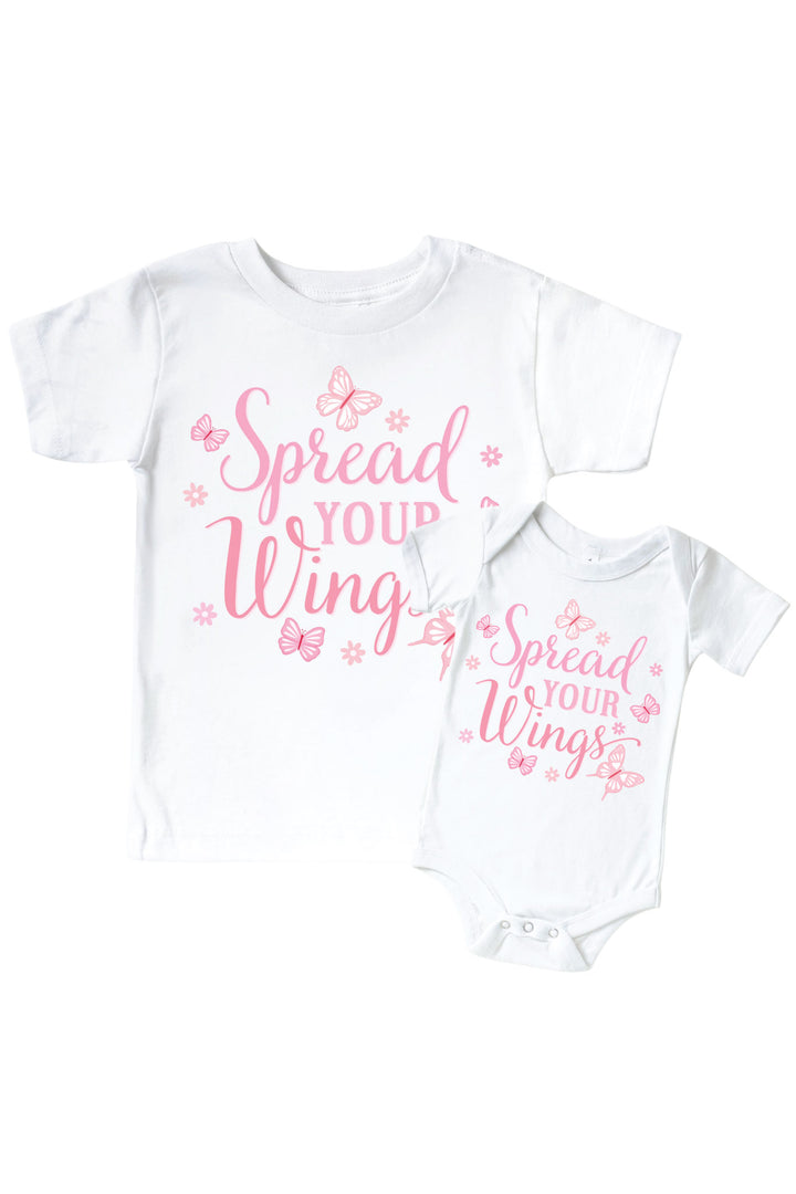 Spread Your Wings Graphic Bodysuit & Kids Tee in Blooming Butterflies print - white tee and baby bodysuit shown together, both featuring pink "Spread Your Wings" lettering with butterfly accents