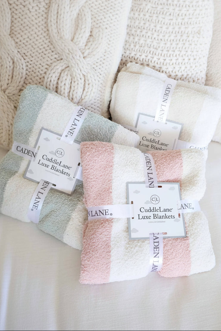 group of striped microfiber blankets in sage, rose and toffee
