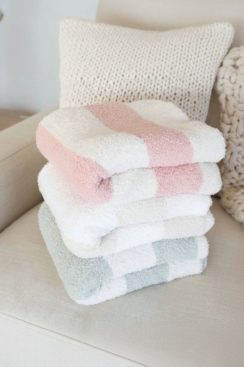 cuddlelane luxe striped collection with pink, sage and neutral microfiber blankets 