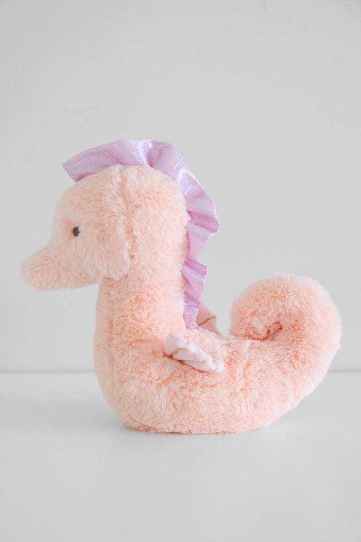 large summer ocean stuffed animals — cuddle plush friends collection displayed on beach