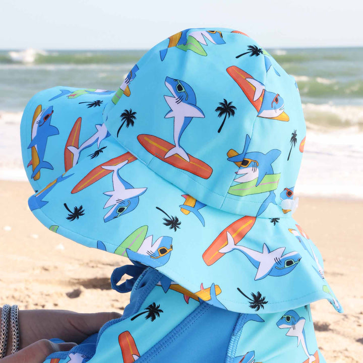 blue bucket hat for kids with sharks, surf boards and palm trees print