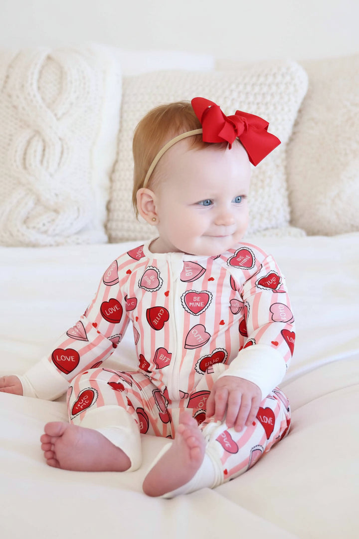 long sleeve and pant convertible zip romper pajama for girls with stripes and candy hearts for valentine's day