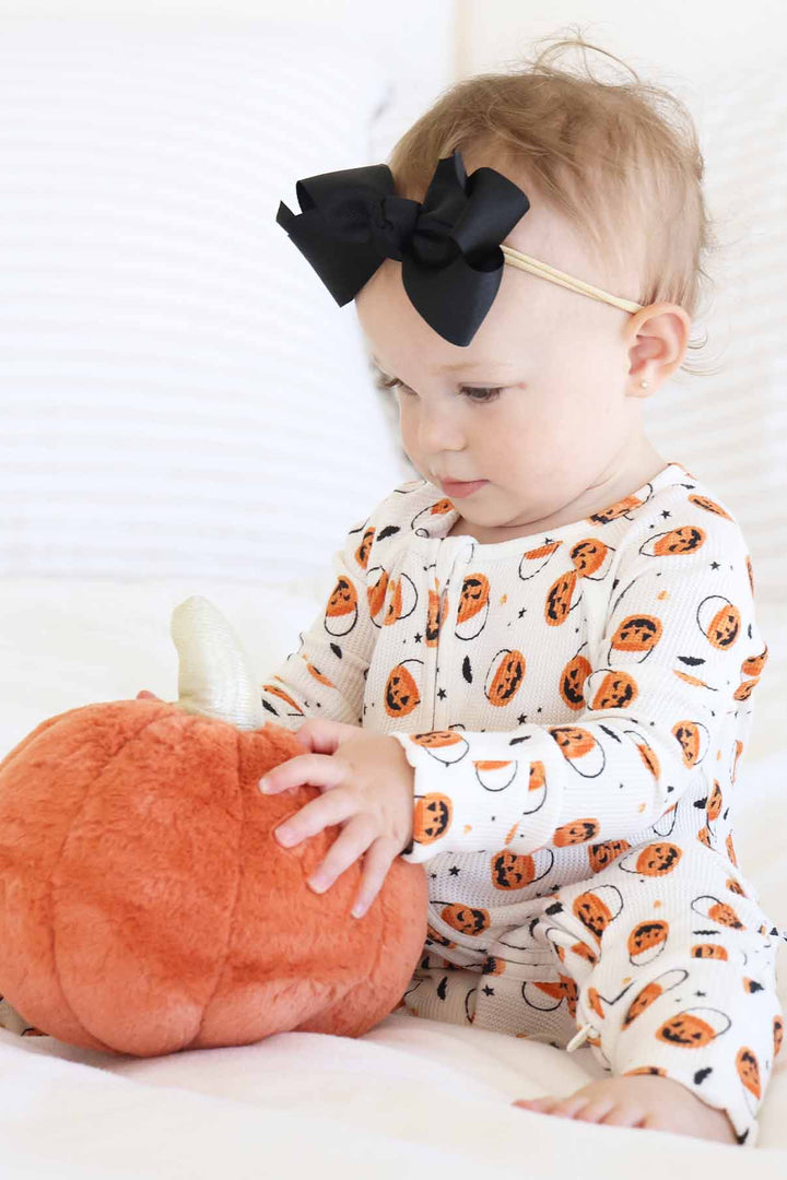 tan background orange pumpkin trick or treat bag zip romper pajama with flip mitts and footies 