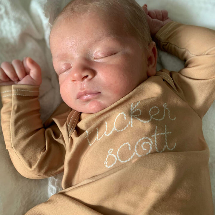 stitched name newborn knot gown warm neutrals 