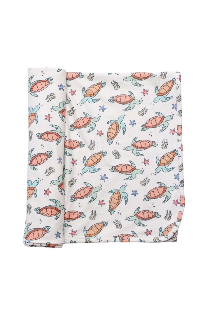 reverse side of turtley rad bamboo blanket showing solid backing