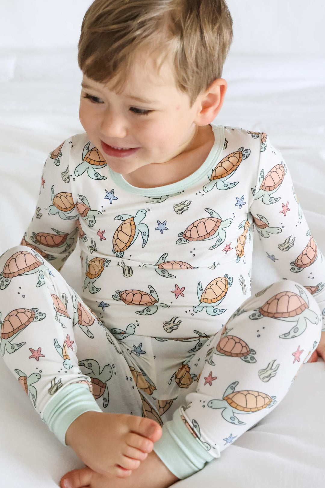 baby wearing turtley rad bamboo two piece pajamas – turtle print sleepwear for little ones