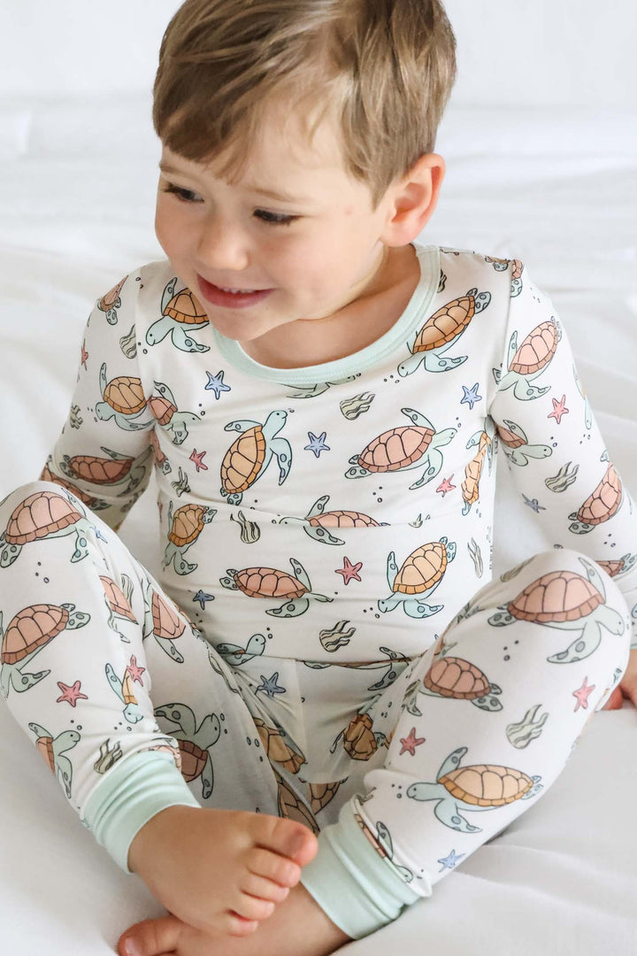baby wearing turtley rad bamboo two piece pajamas – turtle print sleepwear for little ones