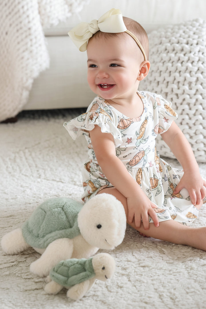 turtley rad sleeveless twirl bodysuit in bamboo with turtle print for newborns