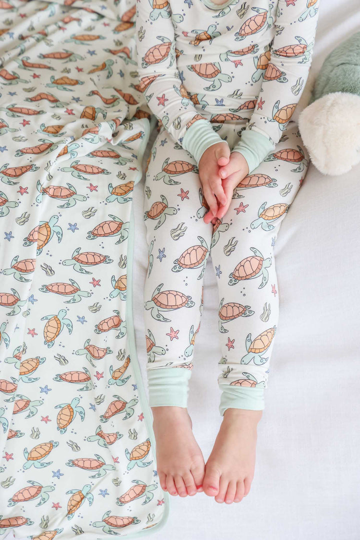 turtle print detail on bamboo – soft and breathable baby sleepwear fabric