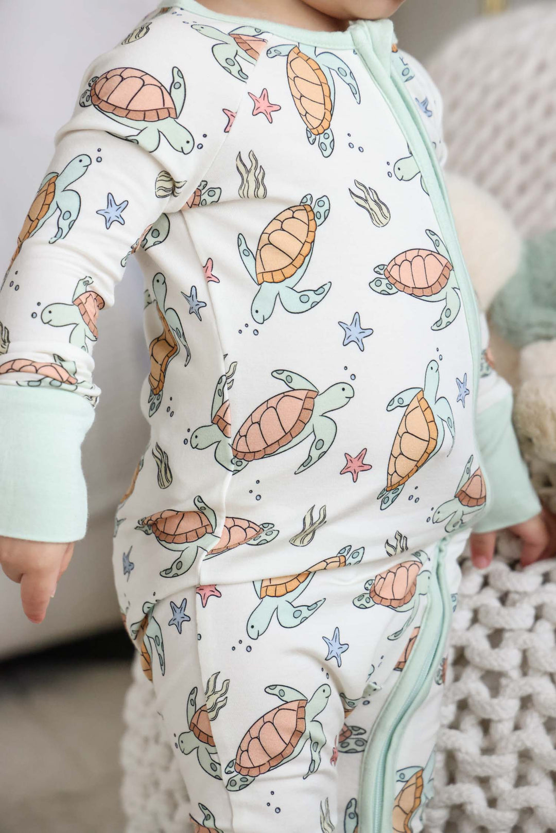 turtley rad bamboo convertible zip romper on a baby – gender neutral turtle print