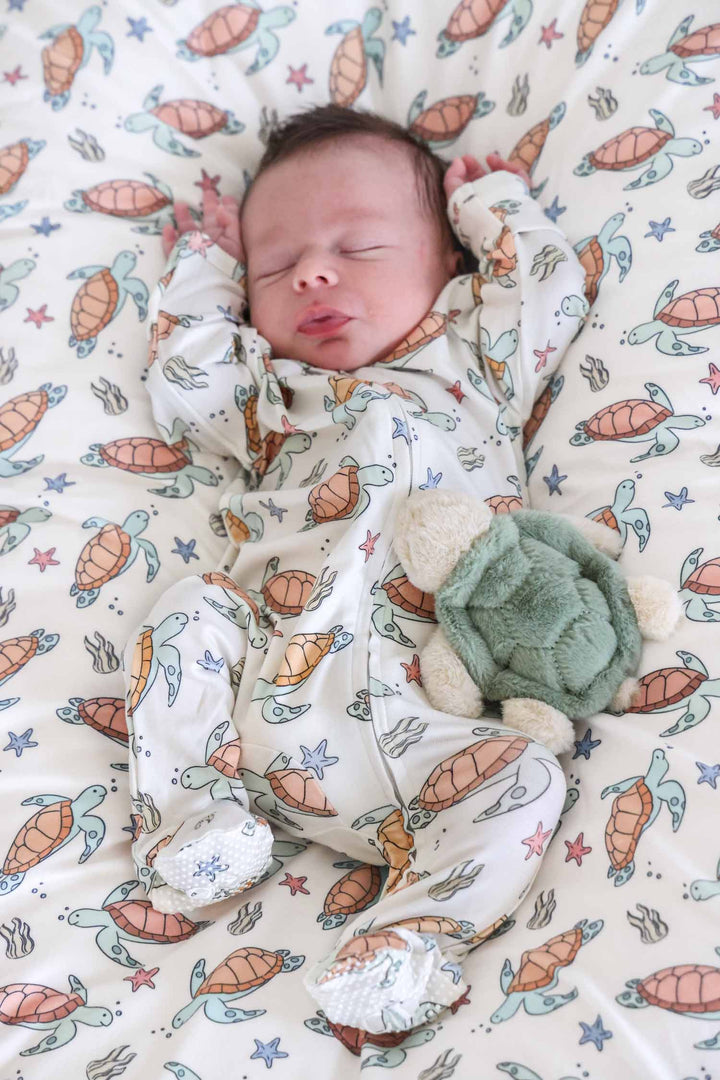 close-up of turtley rad turtle print on bamboo fabric – playful gender neutral design
