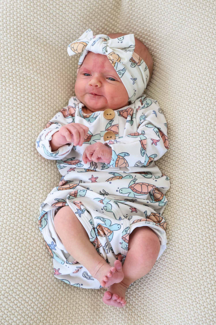 baby wearing turtley rad bamboo knot gown – turtle print sleepwear for little ones