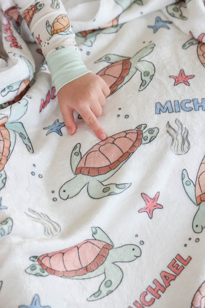 turtley rad personalized blanket lifestyle photo – customized with name in bamboo
