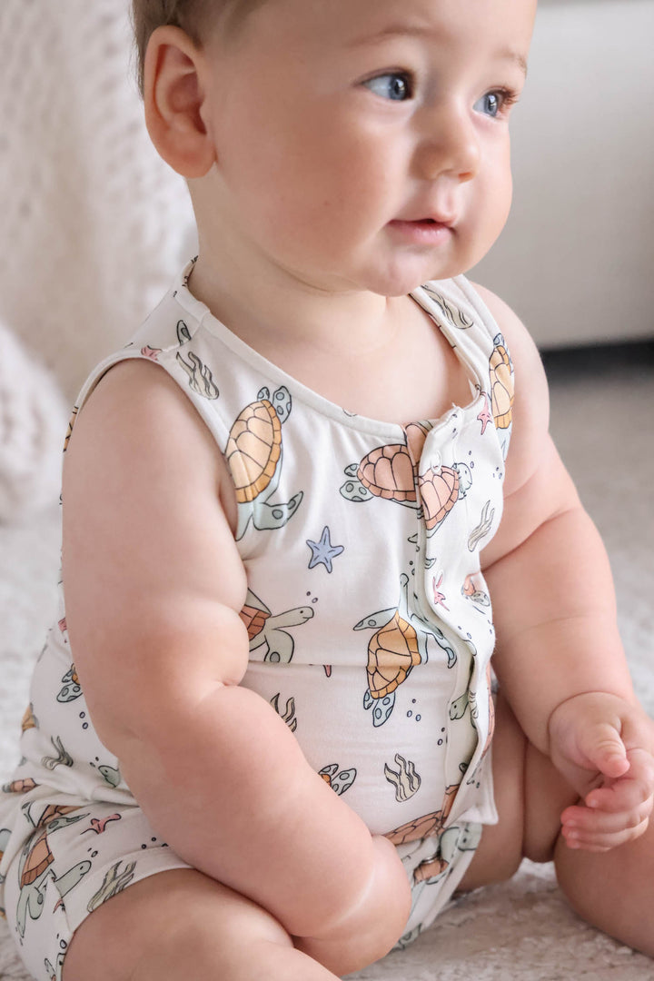 baby wearing turtley rad bamboo sleeveless snap romper – turtle print sleepwear for little ones