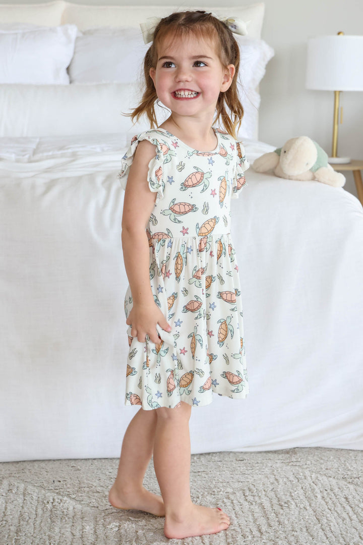 close-up of turtley rad turtle print on bamboo fabric – playful gender neutral design