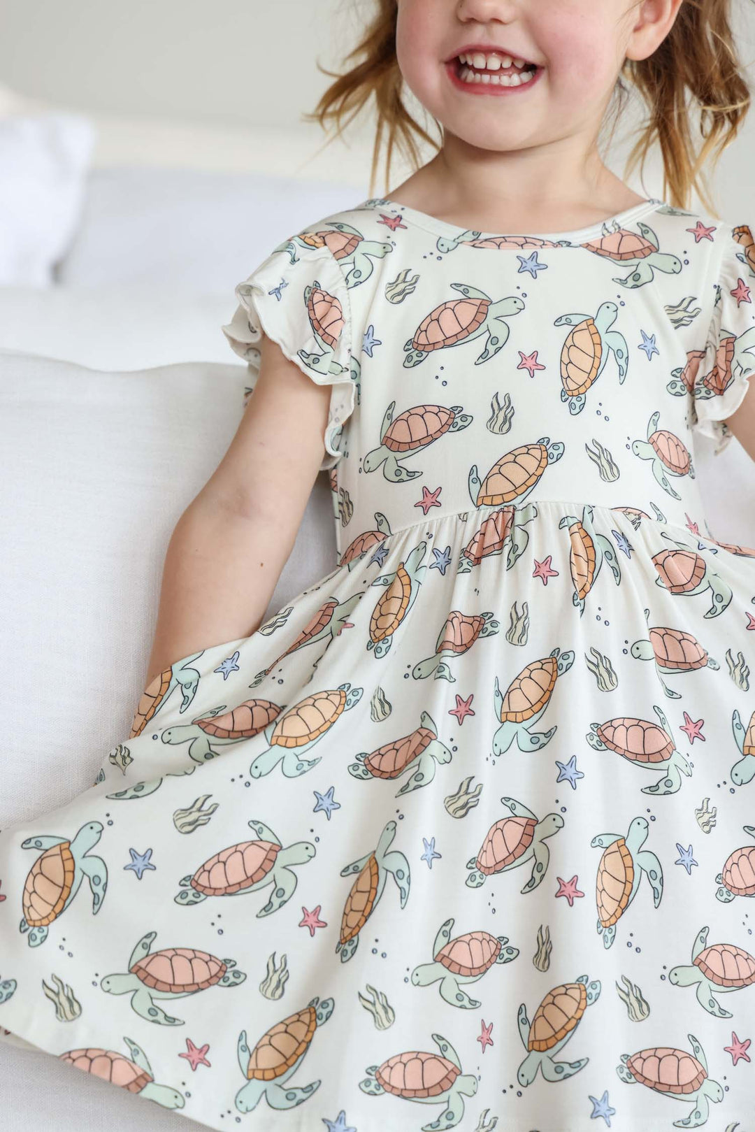 turtley rad bamboo twirl dress on a baby – gender neutral turtle print