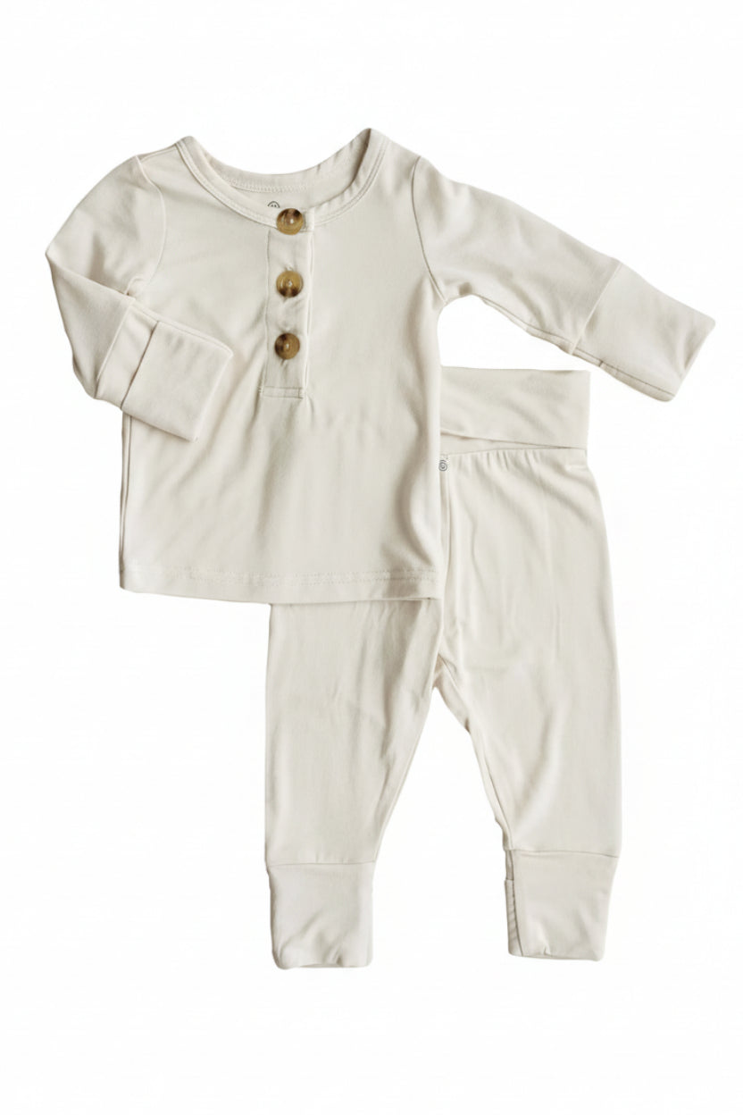 Caden Lane baby outfit set with shirt and pants on a white background