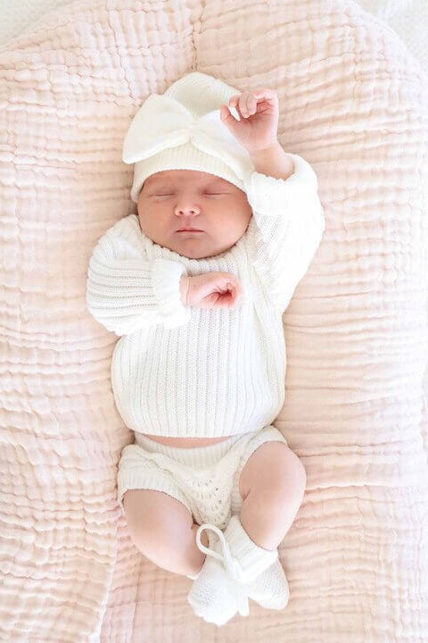 white baby booties with bows