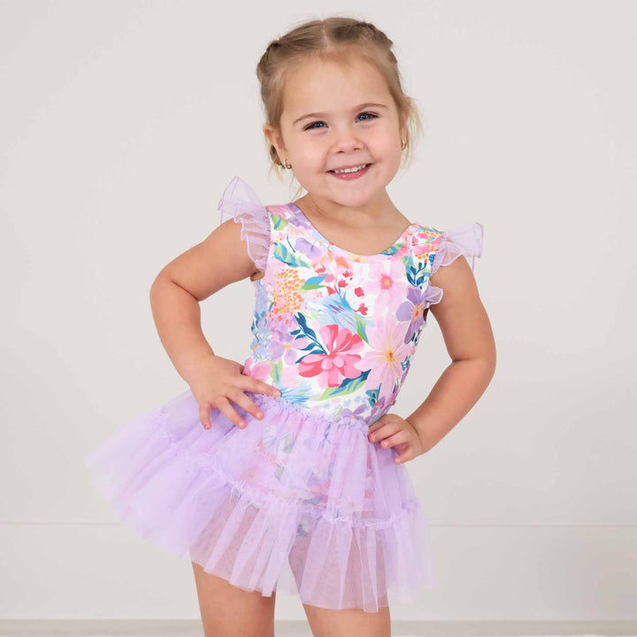 girl wearing spring floral print ballerina leotards with lavender tutu