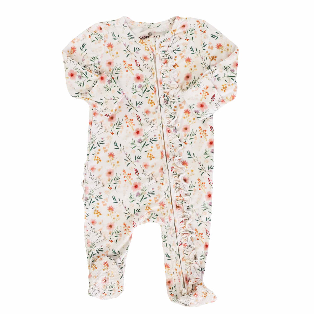 zip footie romper in dainty floral print with ruffles