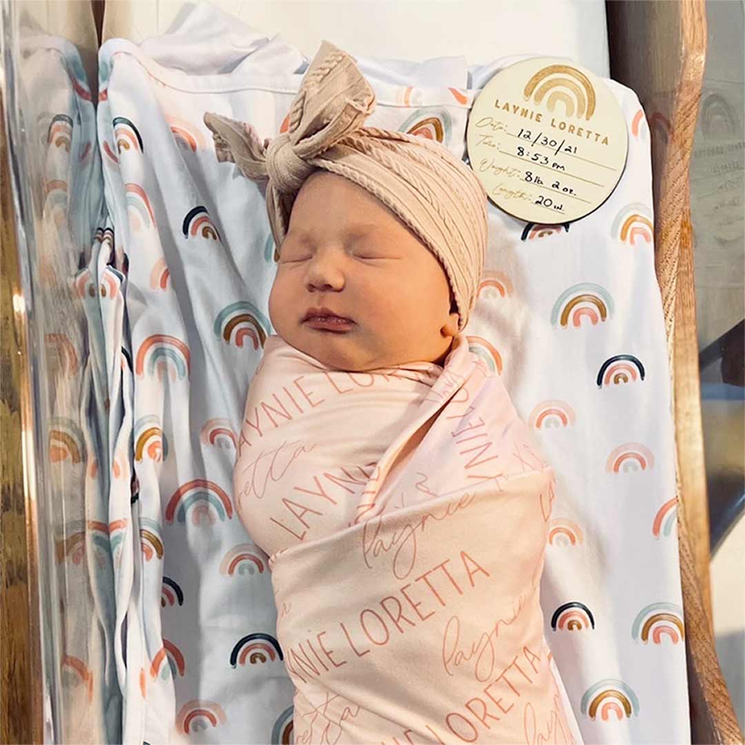 light rose on pink swaddle